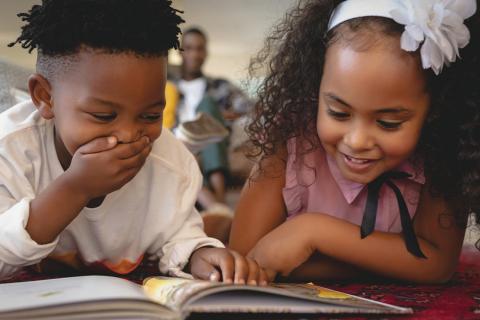 children reading a book