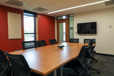 Medium size room with rectangular table and chairs