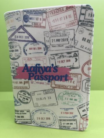 folio to cover a passport with travel stamps and a name