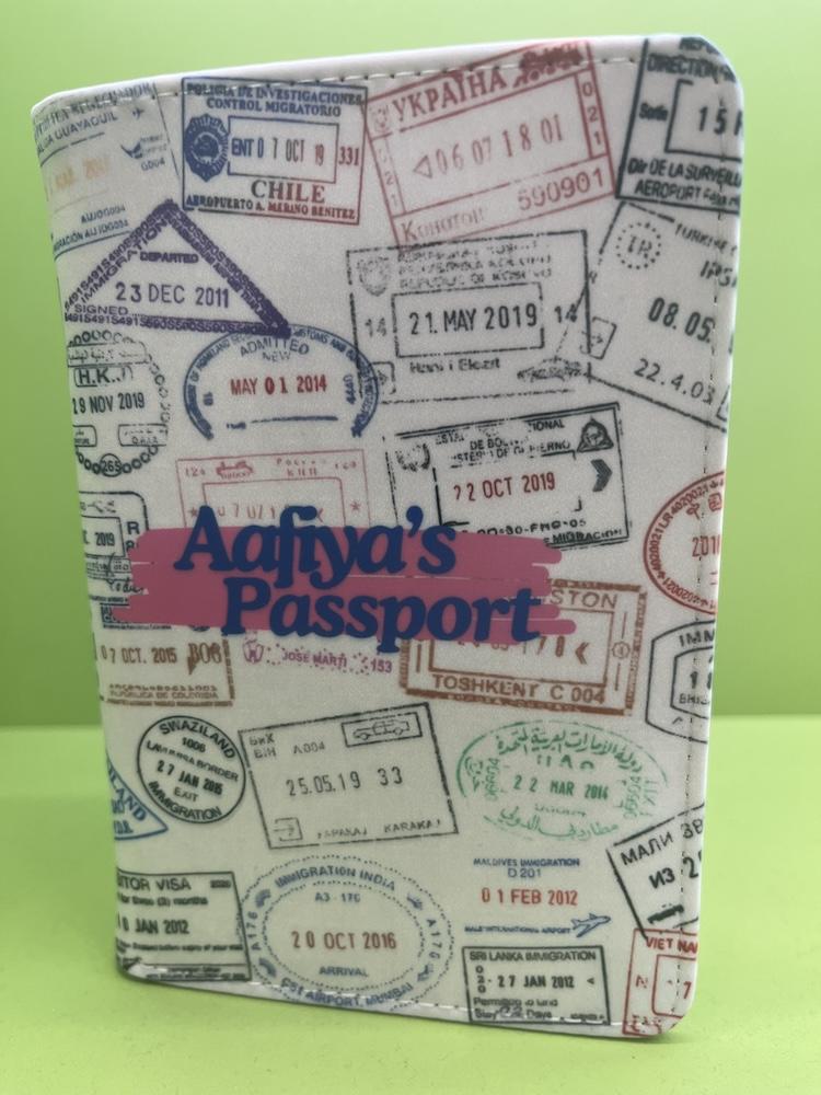 folio to cover a passport with travel stamps and a name