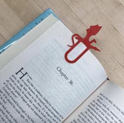 print book with dragon bookmark clipped to page